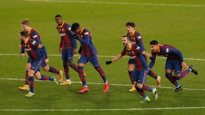 Barcelona players celebrate after winning the penalty shootout. Reuters