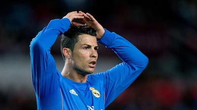 Cristiano Ronaldo of Real Madrid reacts as he fails to score during the Primera Liga match against Sevilla at Estadio Ramon Sanchez Pizjuan on March 26, 2014 in Seville, Spain. Gonzalo Arroyo Moreno / Getty Images