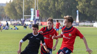 Muscat Football Academy and CS Luceafarul in action during the under 14 final at the Manchester City Abu Dhabi Cup. Victor Besa / The National