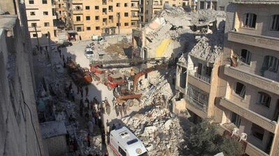 Syrian Civil Defence members search for survivors amid the rubble following reported Russian air strikes the previous night on the Syrian northwestern city of Idlib. Omar Haj Kadour / AFP