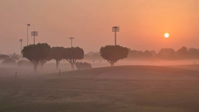 Morning mist blankets Abu Dhabi City Golf Club. Gareth Butler / The National