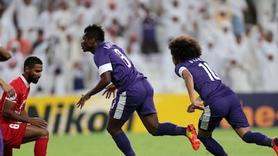 Asamoah Gyan celebrates scoring the opening goal in Al Ain's Asian Champions League last-16 second leg against Al Ahli. Christopher Pike / The National