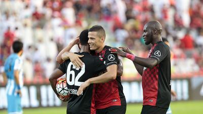 Rodrigo Lima celebrated with his teammates against Dibba. His goal, the team's first in a 2-0 win, was his 14th in 12 matches since arriving in UAE. Jeffrey E Biteng / The National