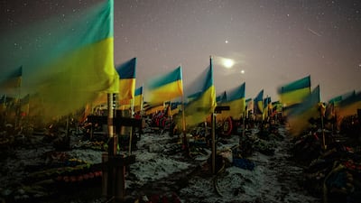 Ukrainian national flags fly over the graves of fallen Ukrainian soldiers in a military cemetery in Kharkiv in 2023. EPA
