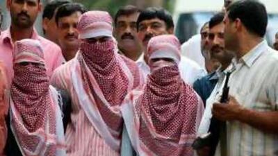 Some analysts say that the parading of suspects in kaffiyehs is part of police bias in India.