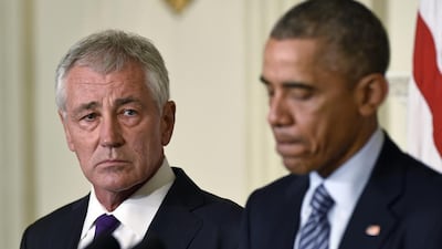 US defence secretary Chuck Hagel, left, is stepping down following a tenure in which he has struggled to break through the White House's insular foreign policy team. AP Photo/Susan Walsh