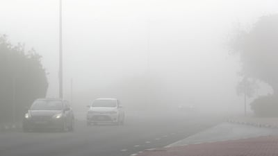 Traffic during the early morning fog in Discovery Gardens area in Dubai. Pawan Singh / The National