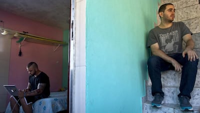 American entrepreneur Elliot Rosenberg, who operates the Favela Experience website, right, waits to show the apartment of Dembore Silva to a potential renter, while Silva, left, works on a laptop, in the Rocinha favela of Rio de Janeiro, Brazil. Silva is expecting to collect 4,000 reais ($1,719) by renting the apartment to World Cup guests willing to sample life in Rio de Janeiro, where federal troops are joining police to combat attacks by drug gangs. Dado Galdieri / Bloomberg