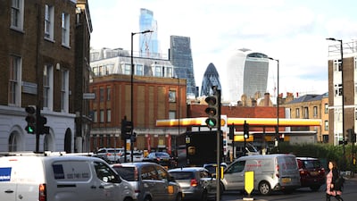 Vehicles queue to fill up at a petrol station in central London. Photo: Reuters