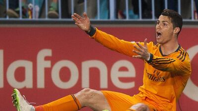 Real Madrid's Cristiano Ronaldo from Portugal gestures during a Spanish La Liga soccer match at La Rosaleda stadium in Malaga, Spain, Saturday March 15, 2014. AP Photo/Daniel Tejedor