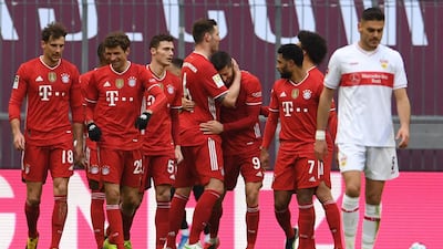 Bayern's Polish forward Robert Lewandowski celebrates scoring his team's fourth goal with teammates. AFP