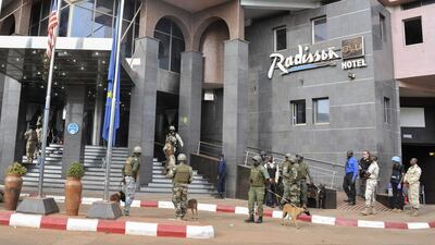 Security forces surround the Radisson Blu Hotel during a hostage situation in Bamako, Mali. EPA/STR