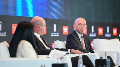 Martin Tricaud, group head of investment banking at First Abu Dhabi Bank, left, and Simon Williams, chief economist at HSBC, at the Abu Dhabi Economic Summit. Khushnum Bhandari / The National