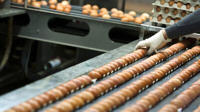 A worker checks chicken eggs as they run through a machine before they are dyed for Easter at Baumeister egg and chicken farm in Breckerfeld, Germany. Sascha Schuermann/ Getty Images