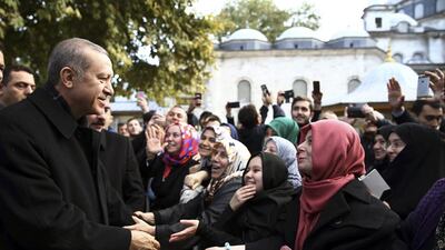 Turkey's president Recep Tayyip Erdogan speaks to supporters after morning prayers at Eyup Sultan Mosque in Istanbul. Presidential Press Service/ AP Photo