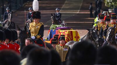 The cortege carrying the coffin of Queen Elizabeth II makes its way to from Buckingham Palace to Westminster Hall. Bloomberg