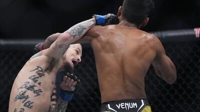 Sean O'Malley lands a hit against Raulian Paiva. Reuters