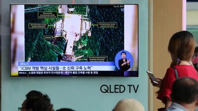 A TV screen shows a satellite image of North Korea's Sohae launch site, during a news program at the Seoul Railway Station in Seoul, South Kora. AP