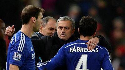 Chelsea manager Jose Mourinho, centre, reacts with Cesc Fabregas, right, and Branislav Ivanovic after their English Premier League match against Stoke City at the Britannia Stadium in Stoke, Britain on December 22, 2014. EPA/NIGEL RODDIS