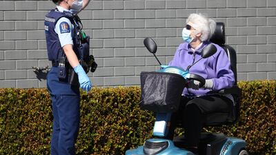 A police office directs a shopper away from the closed Lynn Mall. Getty Images