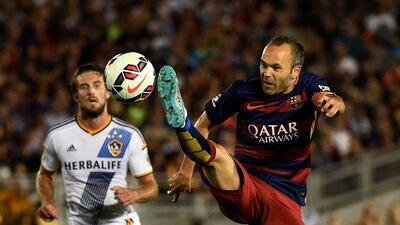 Barcelona's Andres Iniesta lunges at the ball on Tuesday during his side's pre-season tour match against LA Galaxy in California. Mark Ralston / AFP