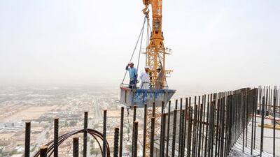 Foreign workers work at a construction site in Riyadh, Saudi Arabia. Reuters