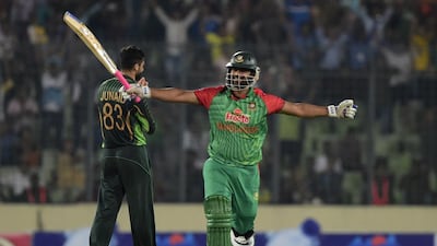 Bangladesh opener Tamim Iqbal celebrates after scoring a hundred against Pakistan on Sunday. Munir uz Zaman / AFP