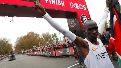 Kenya's Eliud Kipchoge, the marathon world record holder, celebrates after crossing the finish line during his attempt to run a marathon in under two hours in Vienna, Austria. REUTERS
