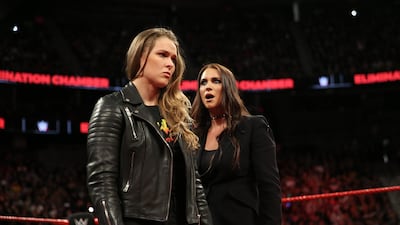 Ronda Rousey, left, will face Nikki Bella for the Raw Women's title at WWE Evolution. Image courtesy of WWE