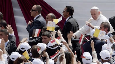 Pope Francis waves as he arrives to celebrate mass for Egypt's tiny Catholic community at the Air Defence Stadium in Cairo on April 29, 2017. Amr Nabil / AP Photo