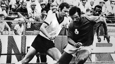 Franz Beckenbauer, left, fights for the ball with Moroccan Benkhrif Boujemaa during the World Cup first round match between West Germany and Morocco, June 1970 in Leon. AFP
