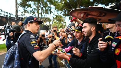Max Verstappen arrives at the circuit and signs autographs for fans. Getty