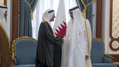 Sheikh Humaid bin Rashid offers condolences to Sheikh Hamad bin Khalifa Al Thani (R) on the passing of his father Sheikh Khalifa bin Hamad Al Thani. Seen with Sheikh Hamad bin Mohammed. Mohamed Al Hammadi / Crown Prince Court - Abu Dhabi