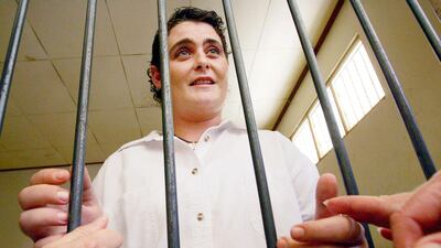 Australian Renae Lawrence holds hands with relative before her drug trafficking trial at a court in Denpasar, Indonesia, in 2005. AFP