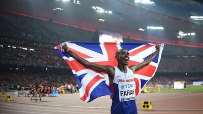 Britain’s Mo Farah celebrates after winning the men’s 10,000-metre run at the World Championships at China’s Bird’s Nest National Stadium on Saturday. Johannes Eisele / AFP