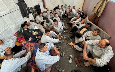 Palestinians who say they were mistreated in detention by the Israeli army, shelter in a school in Rafah, southern Gaza. Reuters