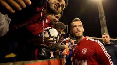 David De Gea has his picture taken with fans. EPA