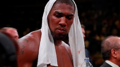 Anthony Joshua looks dejected after losing his WBA Super, IBF, WBO & IBO world heavyweight titles to Andy Ruiz Jr at Madison Square Garden. Reuters