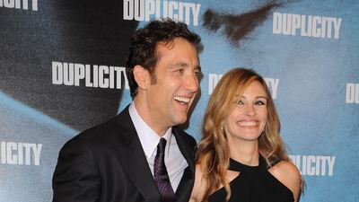 Clive Owen and Julia Roberts, in Lanvin, attend the 'Duplicity' premiere on March 12, 2009 in Paris, France. Getty Images