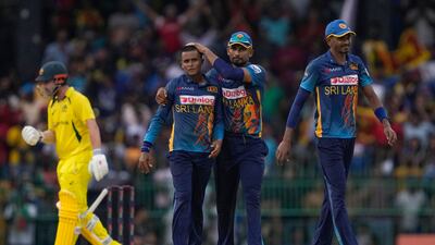 Sri Lanka's Jeffrey Vandersay, second left, is congratulated by captain Dasun Shanaka for the dismissal of Australia's Glenn Maxwell. AP