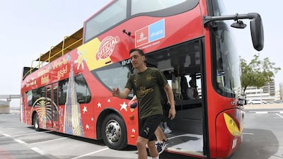 Mesut Ozil hops off the City Sightseeing bus, during the Arsenal visit to the Dubai Frame. at Nad Al Sheba Sports Complex on March 23, 2019 in Dubai, United Arab Emirates.