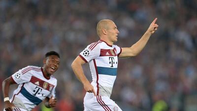 Bayern Munich's Arjen Robben, right, celebrates after scoring during the Uefa Champions League group E match against Roma at the Olimpico stadium in Rome, Italy, 21 October 2014. EPA/ANDREAS GEBERT