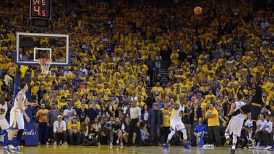 Cleveland Cavaliers guard Kyrie Irving, right, shoots a 3-point basket against the Golden State Warriors during the second half of Game 7 of the NBA Finals at Oakland, California on Sunday. Jose Carlos Fajardo / AP Photo