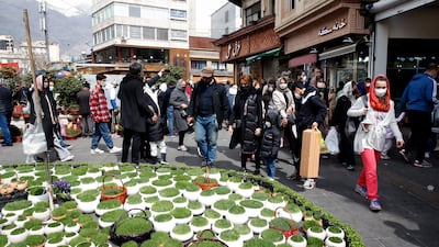 Iranians shop at a street market for Nowruz in Tehran. EPA