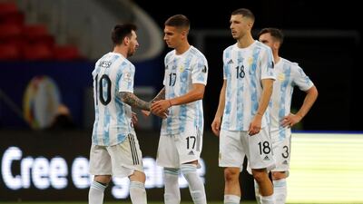 Argentina's Lionel Messi (L) celebrates with his teammates after winning a Copa America match against Paraguay. EPA