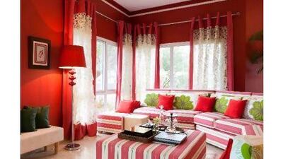 Brian sourced the fabric for the living room, which he says he had hoped would be "a much more tropical print", and had the curved sofas made to measure. Duncan Chard for the National