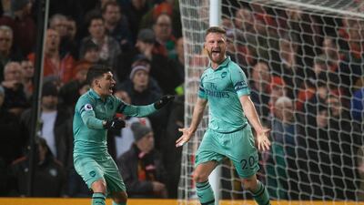 Arsenal's Shkodran Mustafi, right, celebrates scoring the first of his two goals. EPA