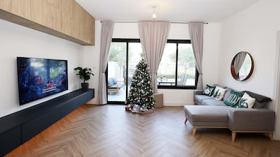 They added lots of storage space on the TV wall in the living room