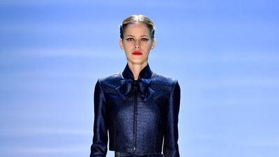 Georges Hobeika showed a glistening navy cropped zippered jacket that could be worn with a pair of jeans and a petal hemmed skirt that would look great with a white T-shirt. Kristy Sparow / Getty Images