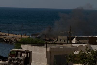 Smoke billows after an Israeli attack on the beach in Gaza City that killed four boys on 16 July, 2014. Heidi Levine / Sipa Press